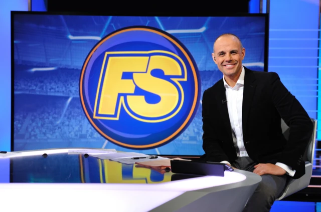 Jason Mohammad, BBC Sport presenter pictured in front of the Final Score logo