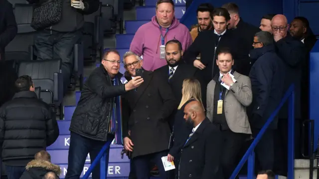 A fan takes a picture with Gary Lineker