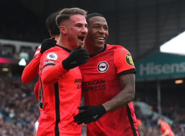 Brighton & Hove Albion's Alexis Mac Allister celebrates scoring their first goal v Leeds with Pervis Estupinan