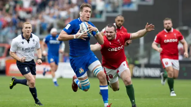 Federico Ruzza evades the tackle of Wales captain Ken Owens