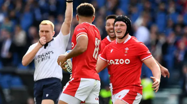 Rio Dyer celebrates Wales' opening try