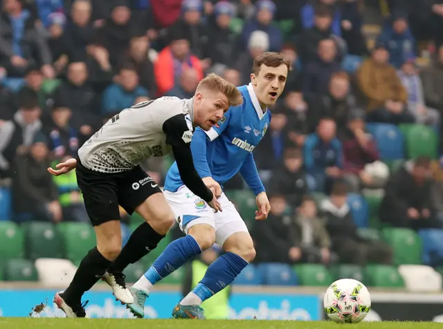 Coleraine's Lyndon Kane and Joel Cooper in a race for the ball