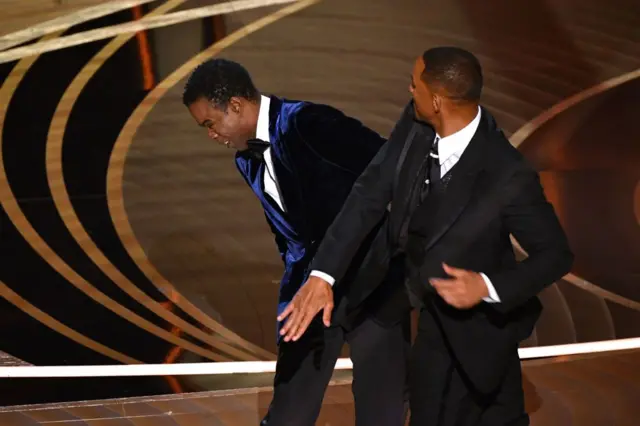 Photo of Will Smith slapping Chris Rock at 2022 Oscars Ceremony