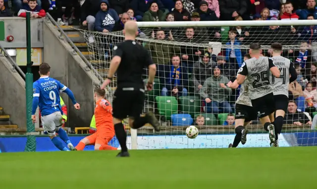 Joel Cooper slots past Gareth Deane to score the opener in the final