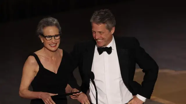 Hugh Grant presented an award along with Andie MacDowell