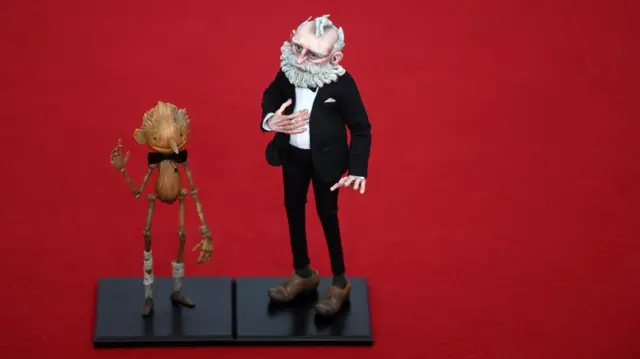 Puppets from Pinocchio by Guillermo del Toro on the red carpet for the 2023 EE BAFTA Film Awards