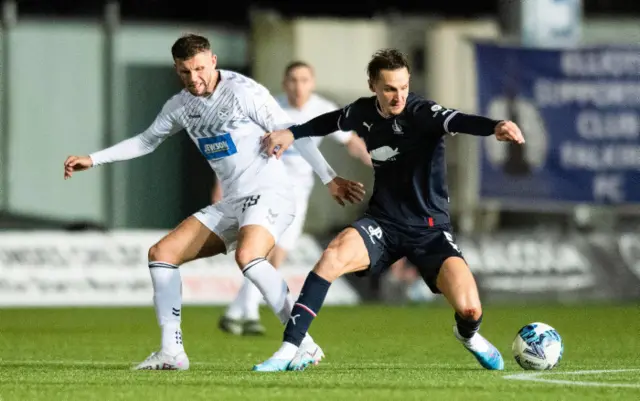 Ayr's Reece McAlear (L) and Falkirk's Liam Henderson