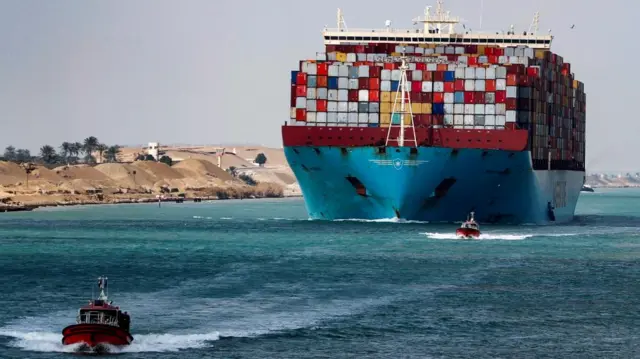 A shipping container passes through the Suez Canal in Suez, Egypt February 15, 2022