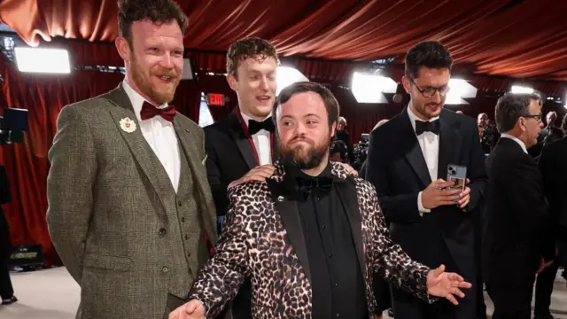 Cast of 'An Irish Goodbye' Tom Berkeley, Seamus O'Hara, James Martin and Ross White pose on the champagne-colored red carpet