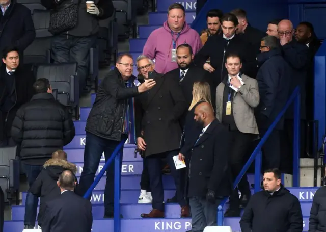 Gary Lineker poses for photographs with fans in the stands ahead of the Premier League match at the King Power Stadium, Leicester