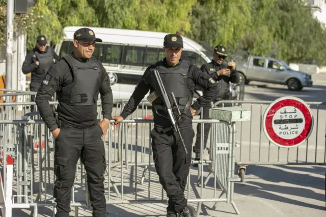 Members of the Tunisian security forces take measures at the entrance to the Parliament during new assembly's first session in Tunis, Tunisia on March 13, 2023