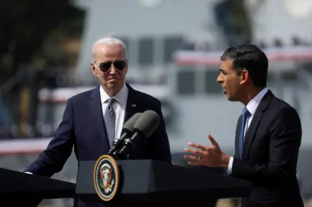 Biden listens as Sunak delivers his remarks