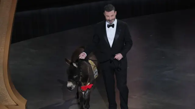 Host Jimmy Kimmel brings out a donkey during the Oscars show at the 95th Academy Awards