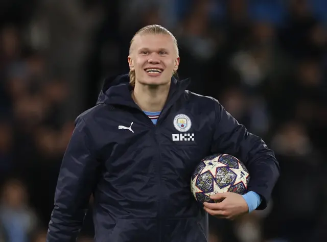 Erling Haaland carries the match ball after scoring five goals against RB Leipzig