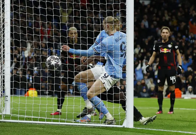 Manchester City's Erling Braut Haaland scores their third goal and his hat-trick