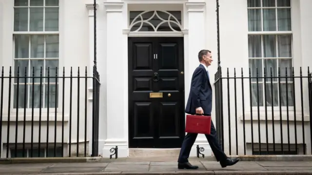 Chancellor of the Exchequer Jeremy Hunt leaves 11 Downing Street, London, with his ministerial box before delivering his Budget at the Houses of Parliament.