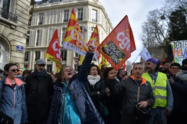 Protesters participate in a demonstration in front of the National Assembly in Paris