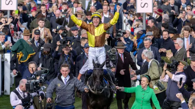 Galopin Des Champs jockey Paul Townend celebrates winning the Gold Cup