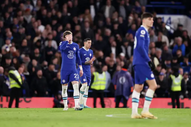 Chelsea players react to their 2-2 draw with Everton