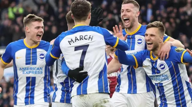 Brighton players celebrate a goal