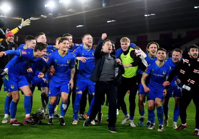 Grimsby's players celebrate knocking out Southampton