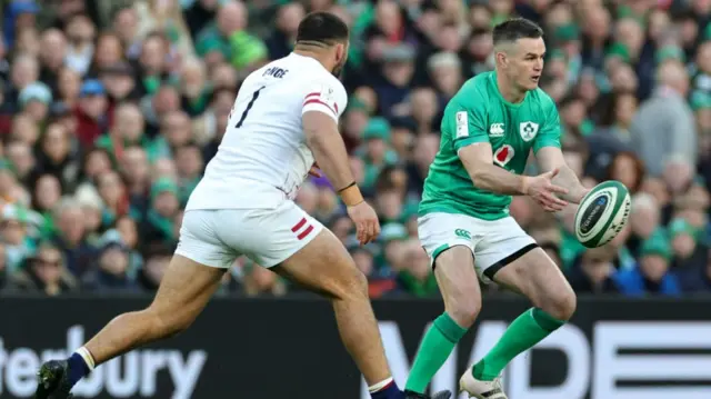 Ellis Genge chases Johnny Sexton