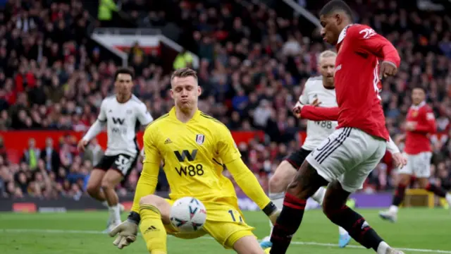 Marcus Rashford has his shot saved by Bernd Leno