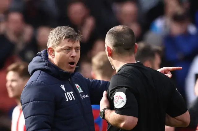 Blackburn manager Jon Dahl Thomasson with referee Tim Robinson