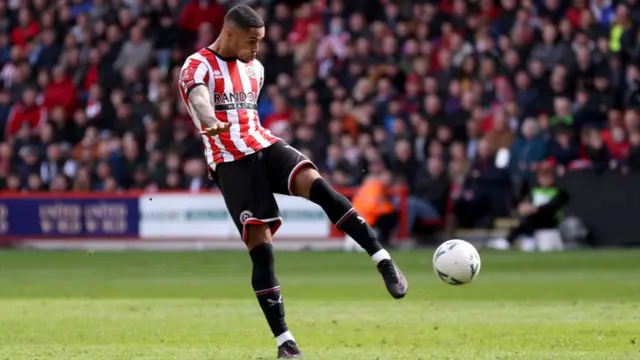 Sheffield United's Max Lowe shoots at goal