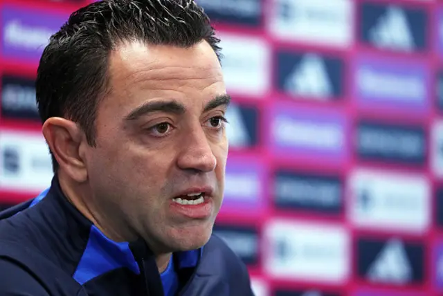 Xavi addresses journalists in a press conference.