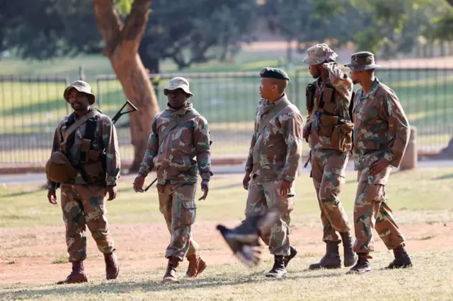 South African National Defence Forces (SANDF) are seen at the south lawns of the Union Buildings in Pretoria on March 20, 2023