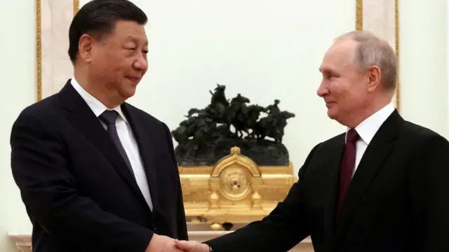 Russian President Vladimir Putin shakes hands with Chinese President Xi Jinping during a meeting at the Kremlin in Moscow, Russia,