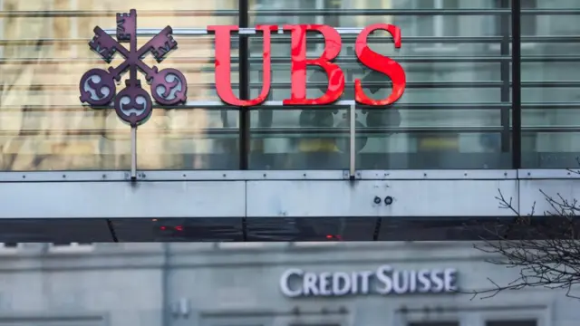 Exterior view of buildings showing the UBS and Credit Suisse logos