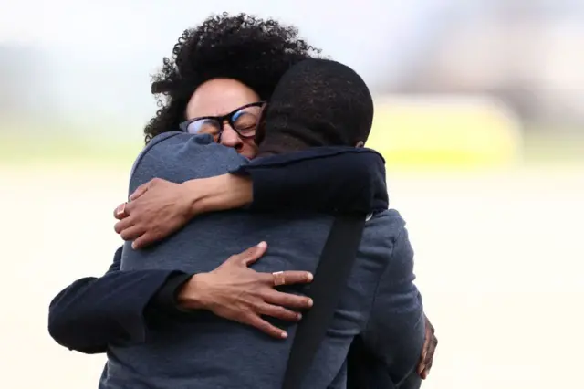 Olivier Dubois hugs a family member.