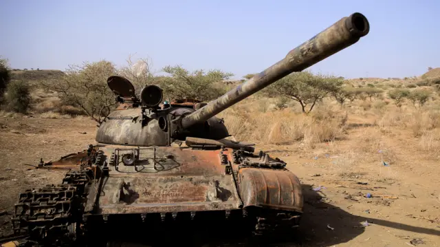 A destroyed tank is seen in a field in the aftermath of fighting between the Ethiopian National Defence Force (ENDF) and the Tigray People's Liberation Front (TPLF) forces in Kasagita town, in Afar region, Ethiopia, February 25, 2022