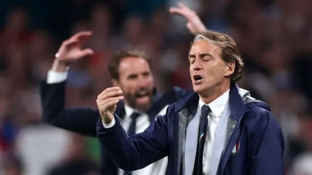 Roberto Mancini looks dejected while Gareth Southgate celebrates behind him