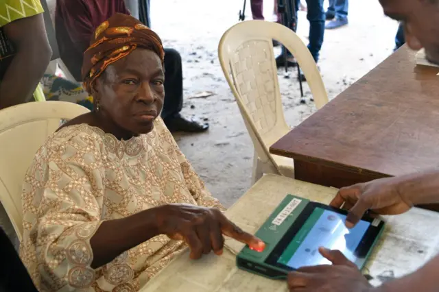 A photo of a woman voting in Lagos on 18 March.