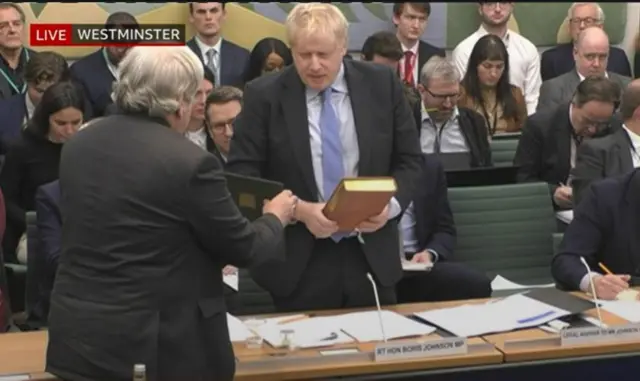 Boris Johnson swearing on the Bible