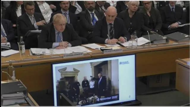 Boris Johnson and the picture of himself at a gathering he was shown during the hearing