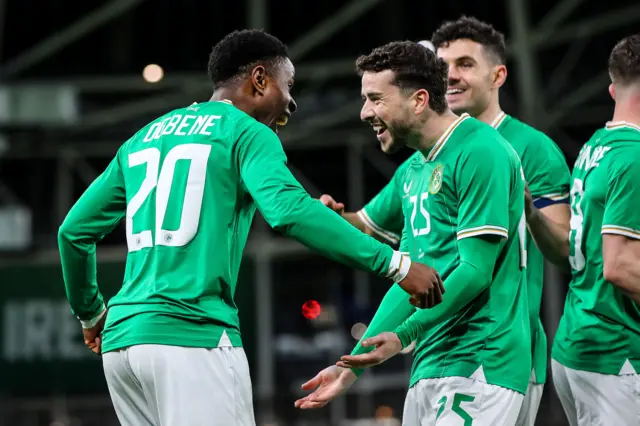 Chiedozie Ogbene celebrates after scoring a goal with Micheal Johnson