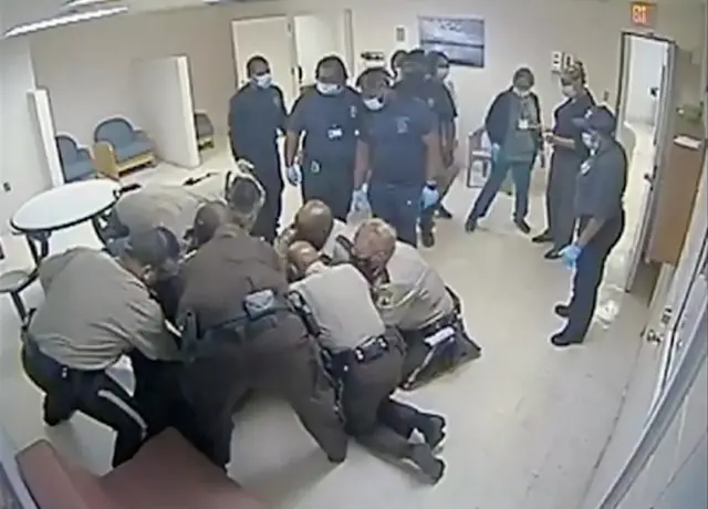 Virginia sheriff deputies wrestle with Irvo Otieno, a 28-year-old Black man, at a state mental hospital before he died