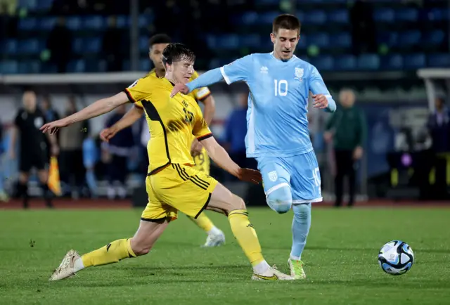 Northern Ireland's Paddy McNair with San Marino's Filippo Berardi