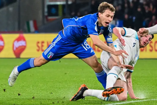 Declan Rice tackles Italy's midfielder Nicolo Barella