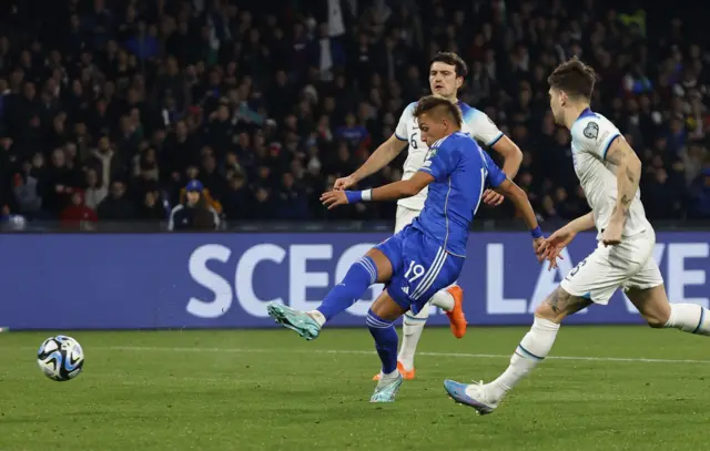 Italy's Mateo Retegui scores against England