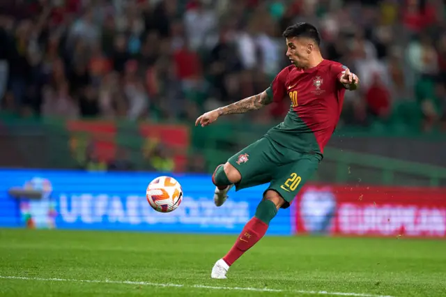 Joao Cancelo of Portugal shoots on goal and scores against Liechtenstein