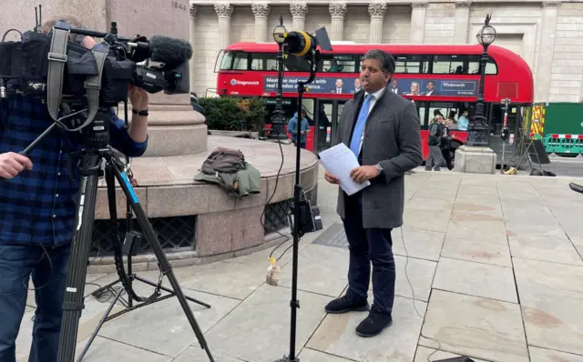 BBC economics editor Faisal Islam preparing for a piece to camera