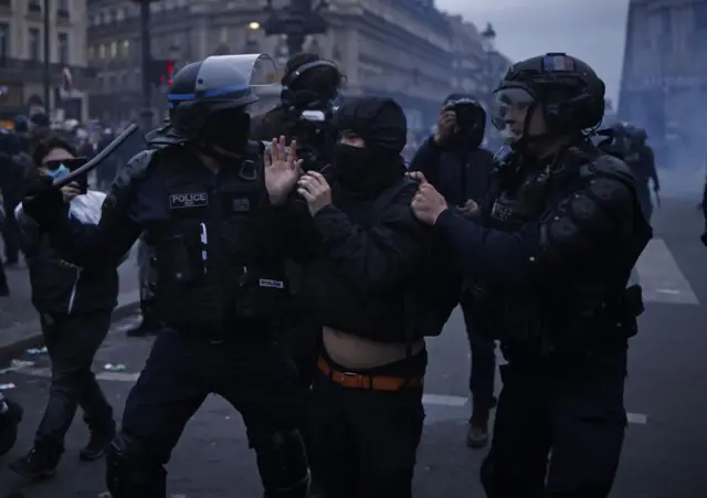 Paris police with a protester