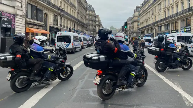 Police on motorbikes on Boulevard de l’Opera in Paris