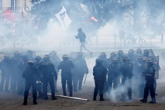 French riot police fire tear gas during clashes with protesters in Nantes, France