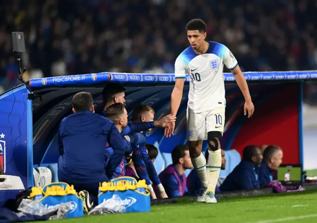 Jude Bellingham of England interacts with England teammates after being substituted